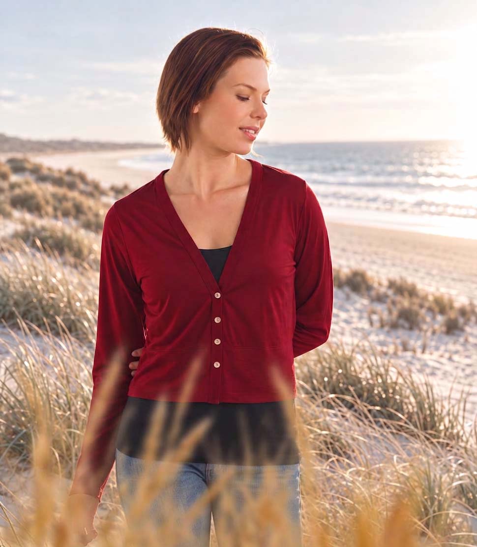 Model wearing Silkspun Cropped V Neck Cardigan in Bordeaux red