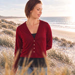 Model wearing Silkspun Cropped V Neck Cardigan in Bordeaux red