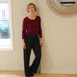 Woman wearing Silkspun Long Sleeved Scoop in Bordeaux red