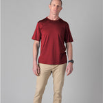 Man wearing a Silkspun Short Sleeve Crew in Bordeaux Red