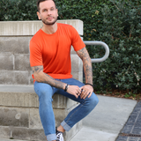 Men's Silkspun Short Sleeve Crew in Orange Blaze on model