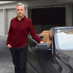 Man wearing a Silkspun Long Sleeved Polo Shirt in Bordeaux Red