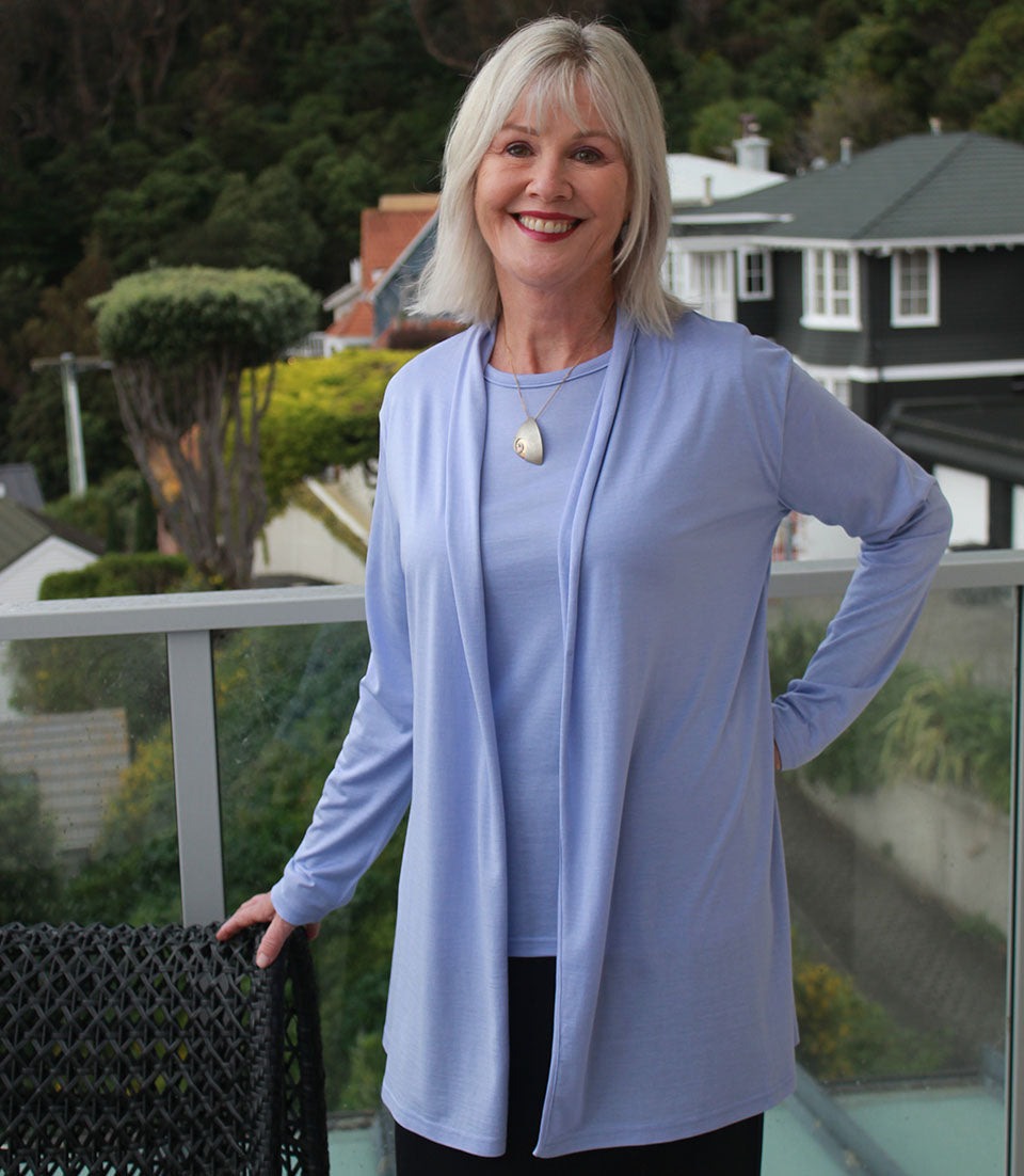 Woman wearing Silkspun Longline Cardigan over a Short Sleeved Crew top in Forget-Me-Not blue