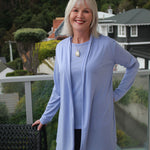 Woman wearing Silkspun Longline Cardigan over a Short Sleeved Crew top in Forget-Me-Not blue