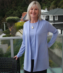 Woman wearing Silkspun Longline Cardigan over a Short Sleeved Crew top in Forget-Me-Not blue