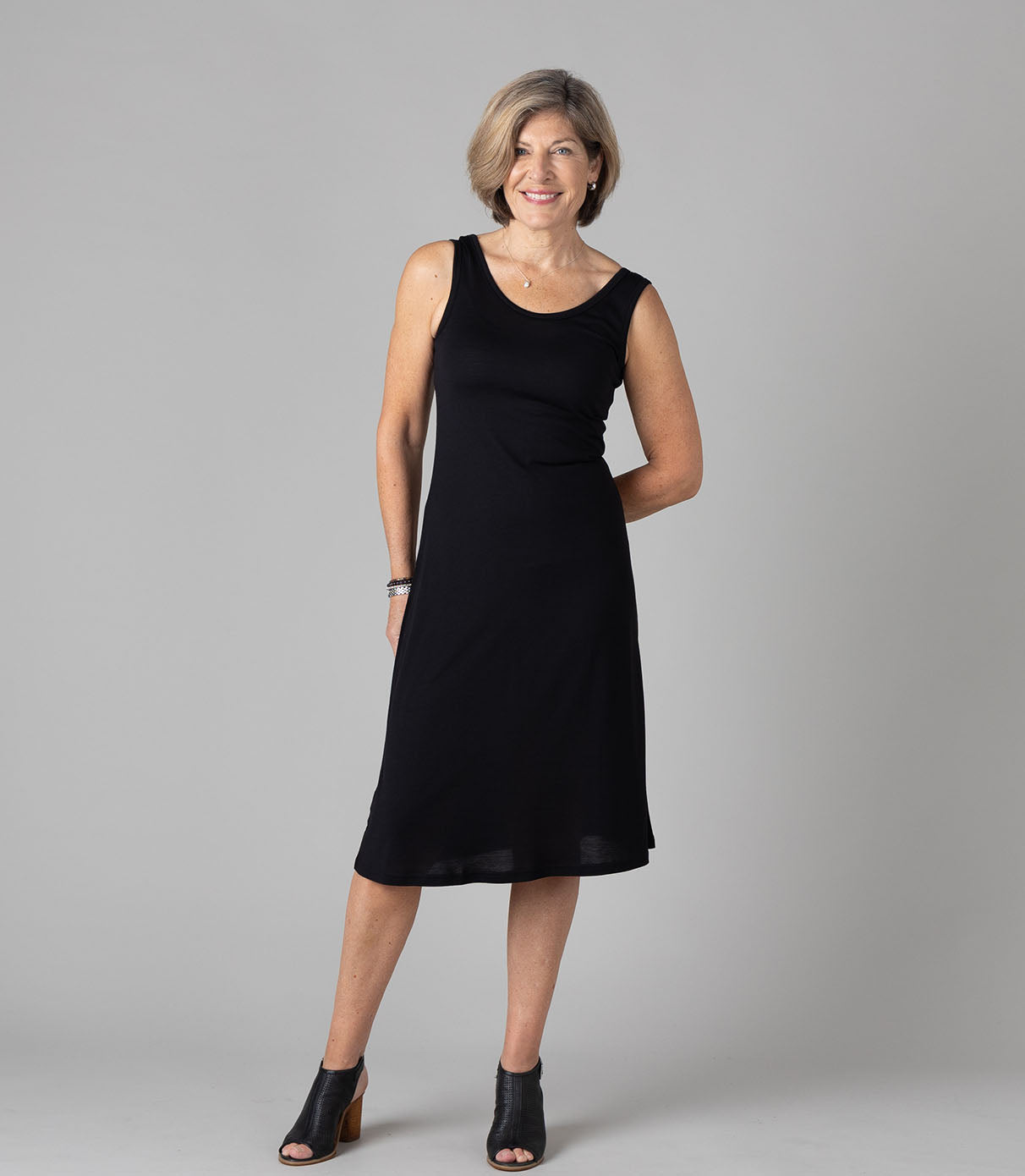 Woman wearing Silkspun Sleeveless Dress in Black